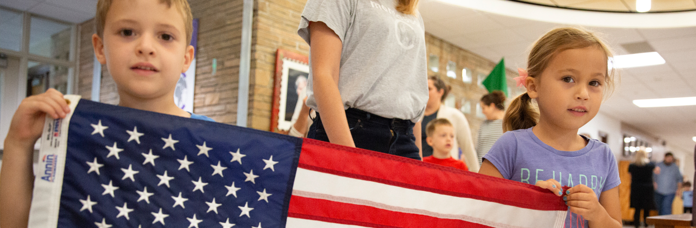 Cowles Montessori School Students Holding American Flag